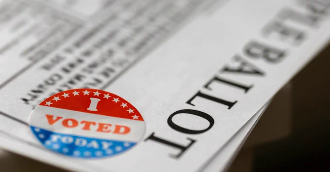 An "I Voted Today" sticker on a Sample Ballot.