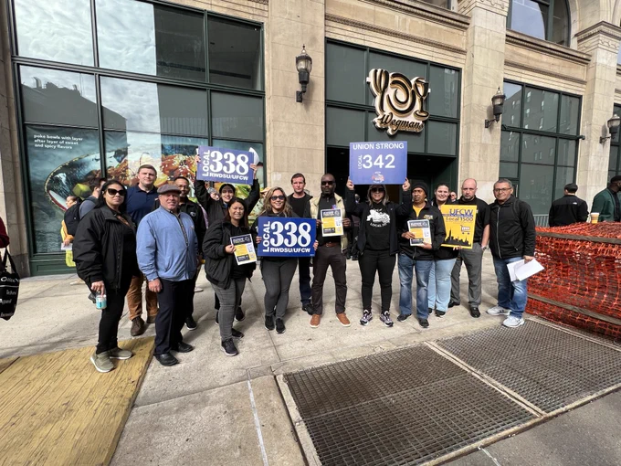 Union representatives from UFCW Locals 338, 342 and 1500 in front of Wegmans in Manhattan. 