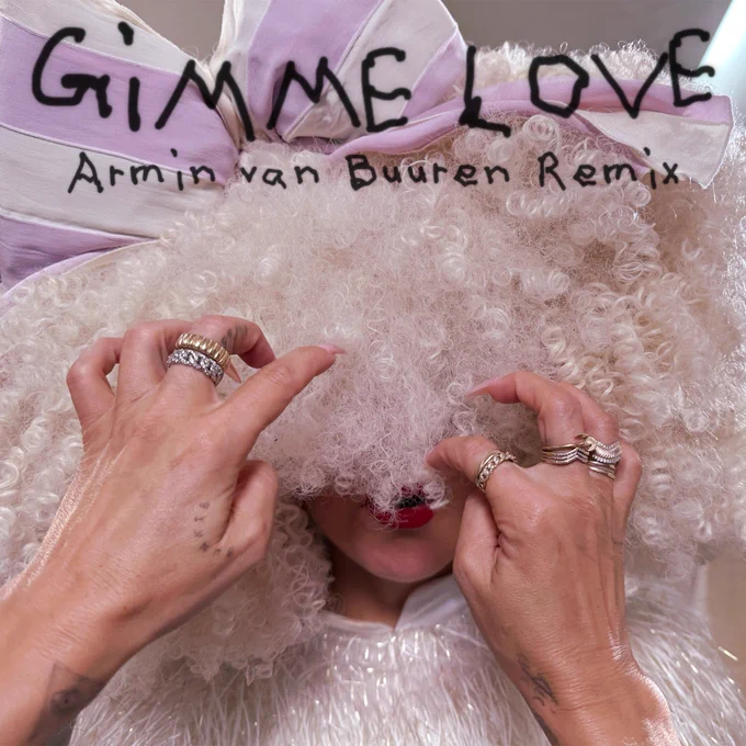 The cover of the Armin van Buuren remix of “Gimme Love” with Sia in a big, white wig and a white   pink bow