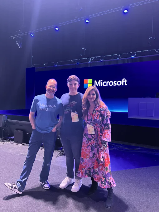 Pic of Lewis, Scott, Dona in front of the keynote stage