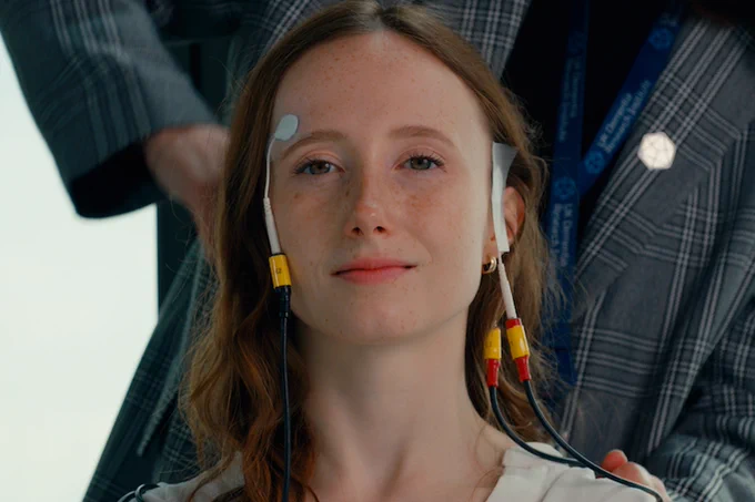 Woman wearing a brain monitoring headset.