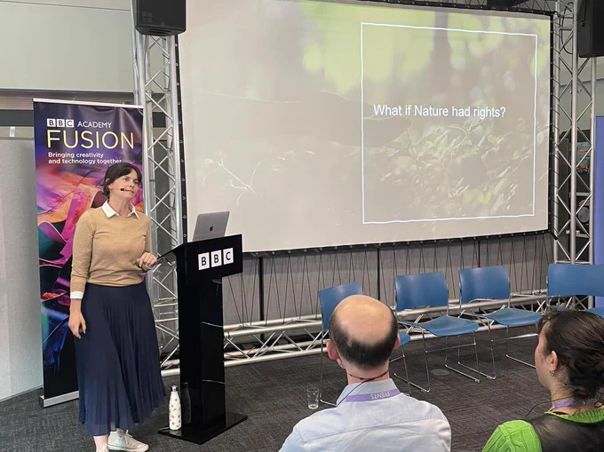 A photo of Brontie Ansel speaking at Climate Creatives 2023.