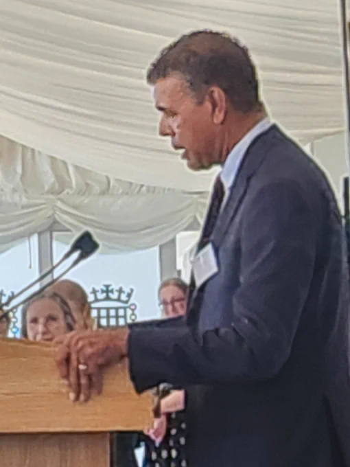 A picture of Chris Kamara speaking at a lecture.
