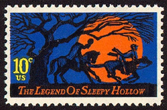 U.S. postage stamp with dark blue background, orange full moon, tree, and two men on horseback; one, headless, chasing the other
