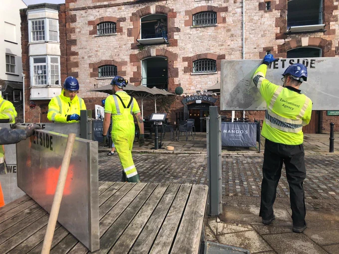 Temporary barrier deployment at Exeter Quay.