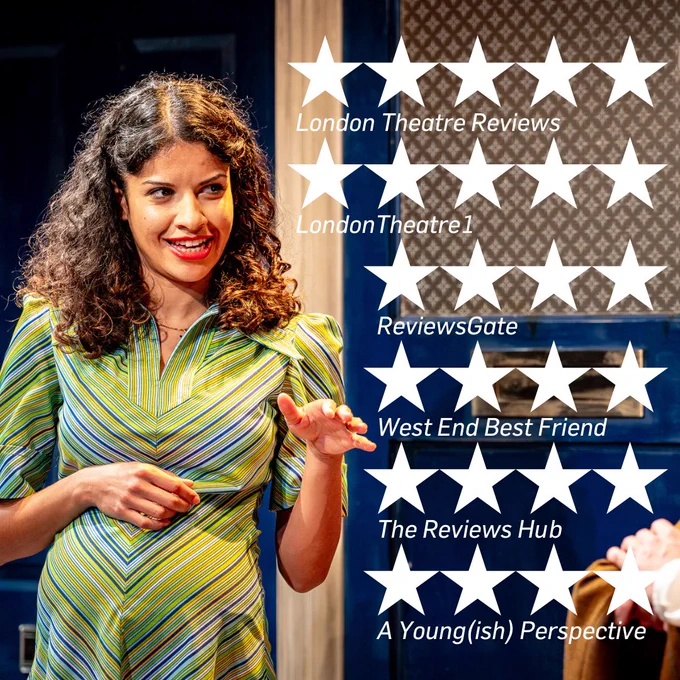 A photo of actress Boadicea Ricketts, who plays Lisa in Jermyn Street Theatre's Owners. She is a woman with brown curly hair wearing a green and blue chevron striped dress. She is obviously pregnant and is gesturing towards a character who is not pictured. The background consists of a royal blue and white door. Superimposed over the right of the image in white are stars designating four and five star reviews. There are two five star reviews (London Theatre Reviews, LondonTheatre1) and four four star reviews (ReviewsGate, West End Best Friend, The Reviews Hub, A Young(ish) Perspective).
