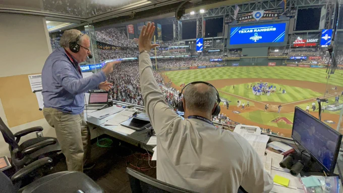 Eric Nadel and Matt Hicks high-fiving
