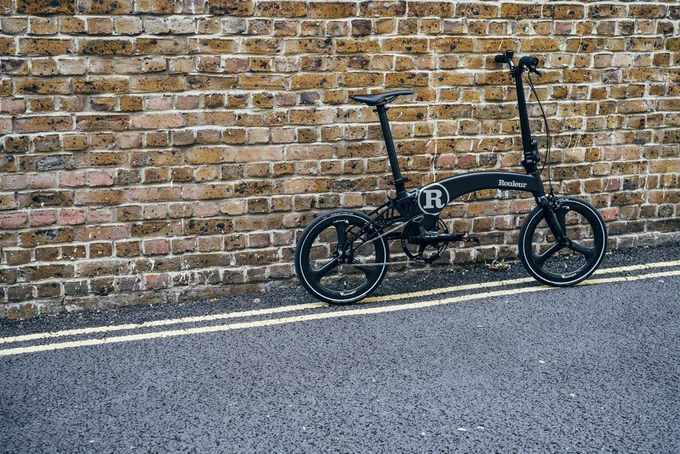Hummingbird Bikes and Rouleur collaboration bike leaning against brick wall