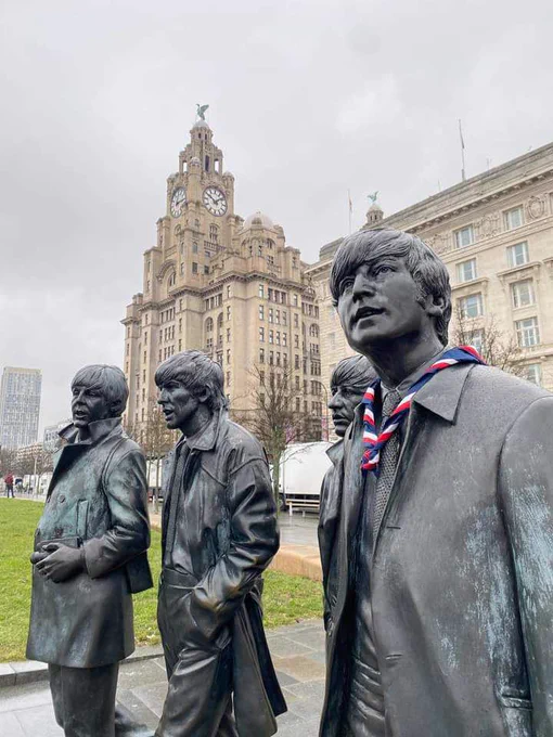 Statues of The Beatles in Liverpool with a Scouts necker. 
