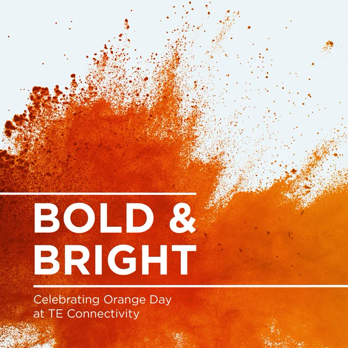 A splash of orange powder. Text: Bold and Bright. Celebrating Orange Day at TE Connectivity.