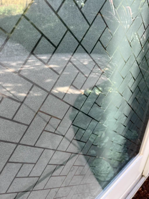 Stationery window with vinyl patterned window film.