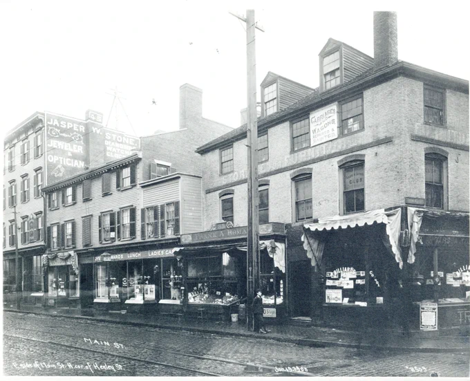  Photograph shows: Jasper W. Stone Jeweler and Optician, Frank A. Roman, Andrew Jackson Club, Ward's Lunch, billiards and pool room and a sign for the Boston Journal