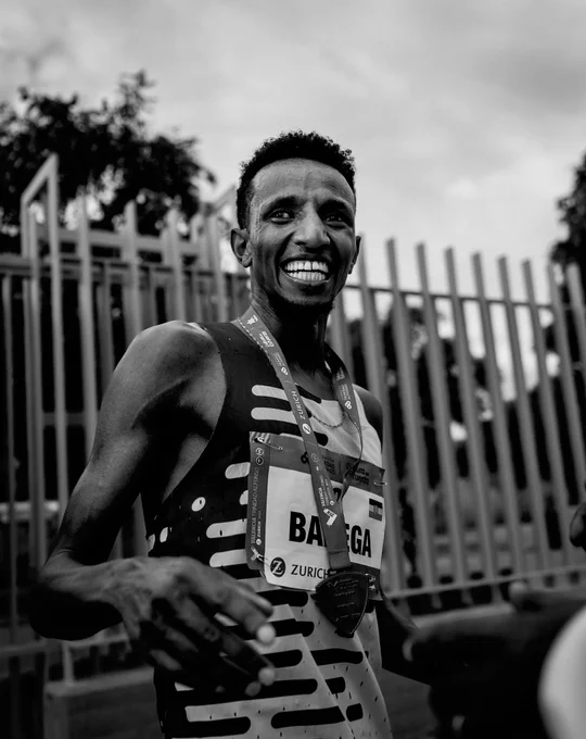 Selemon Barega smiling with his finishing medal