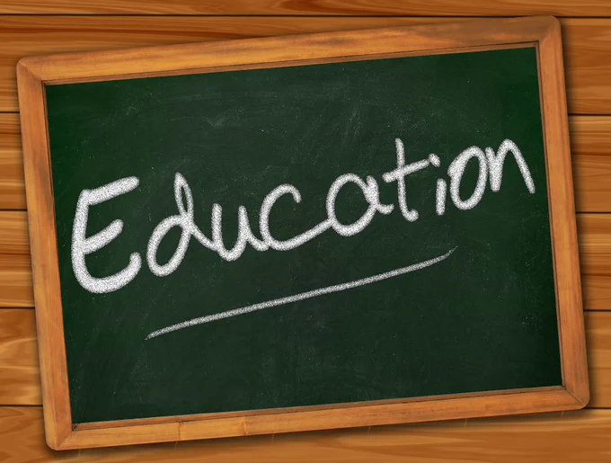 The word 'education' written on a chalk board