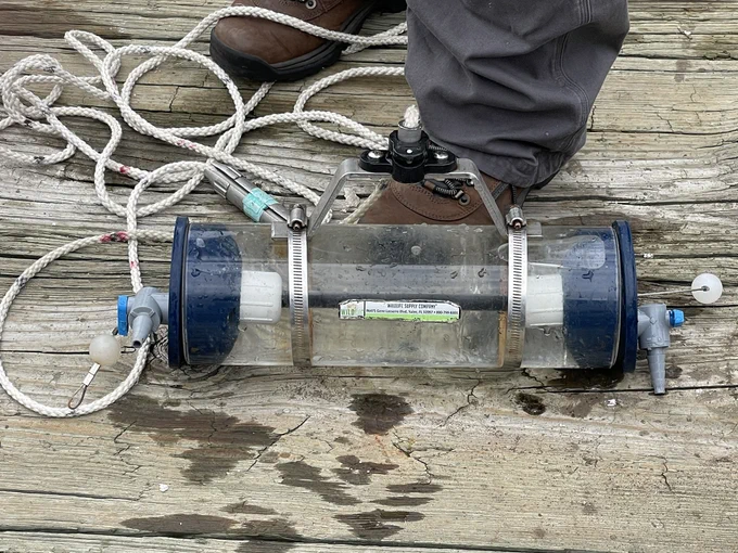 This container is used to collect a water sample for testing by DNR staff.