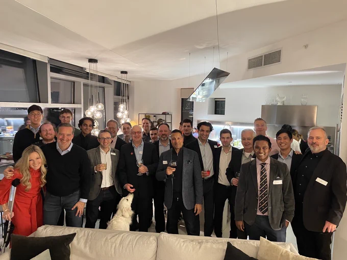 A smiling group of people at a CLS alumni gathering in New York City, November 2022.