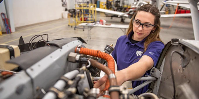 An aviation maintenance student works on a plane on the K-State Salina campus.
