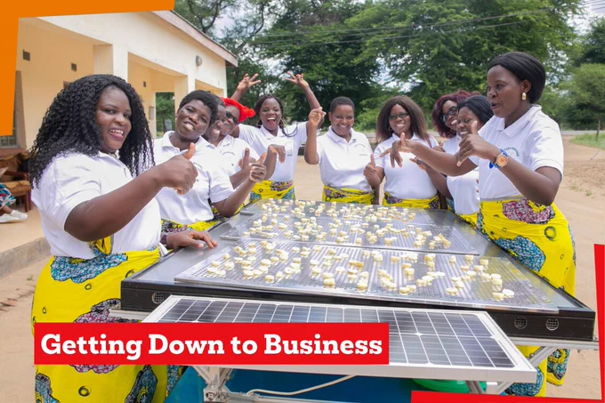 Women in Malawi supporting their livelihoods through women-led decentralised renewable energy enterprises. The women in this image are drying bananas on solar panels.