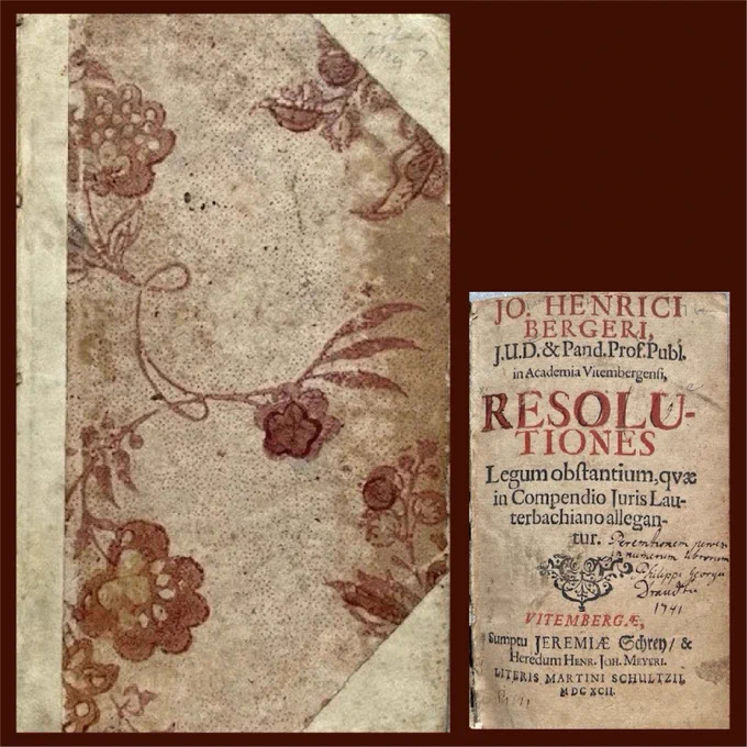  Composite of two images on a deep red background. The first image is a book which is quarter-bound in parchment and a decorative paper cover. The paper features a woodblock print of flowers and vines in deep red ink on a beige background. The second image is the title page from the book, printed in red and black ink on light tan paper, with handwritten notes.