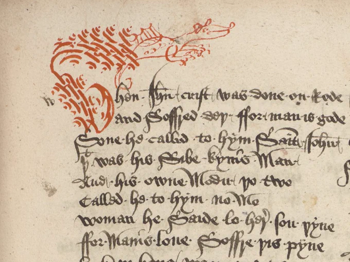 The opening of a Middle English poem: "Whan Ihesu Crist was done on rode".  The opening W, in red ink, ends in a flourish shaped like a dragon.