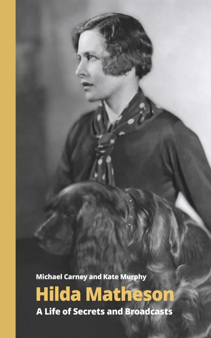 Photograph of the book cover: Hilda Matheson - A life of Secrets and Broadcasts. Book cover features black and white photograph of Hilda and dog with text overlay including title of the book and authors