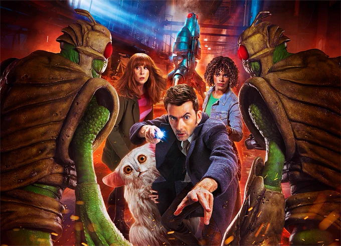 The Fourteenth Doctor, Donna Noble, Rose Noble and Beep the Meep are pictured. They're approached by two armoured green alien foes.