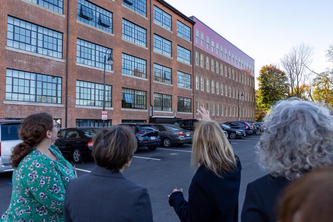 Governor Healey looking at mill turned into housing in Attleboro.