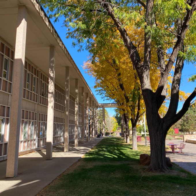 Fall colors on campus featuring the DU College of Natural Sciences & Mathematics building.