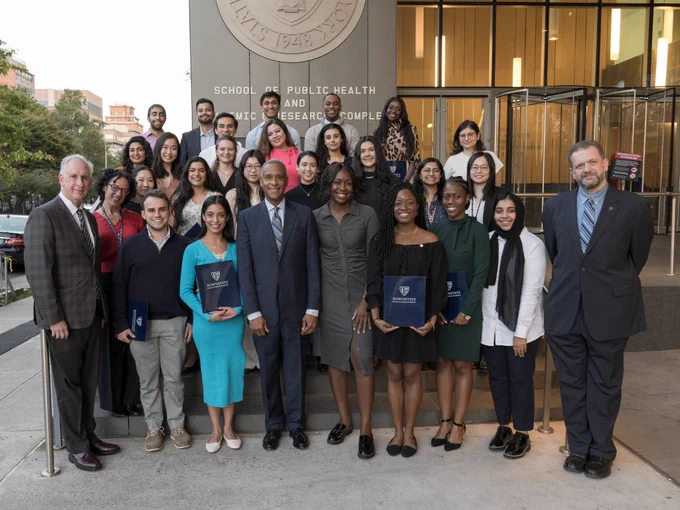 Students inducted into the Gold Foundation Humanism Honor Society with President Riley, Acting Dean Lazar, and Advisors.