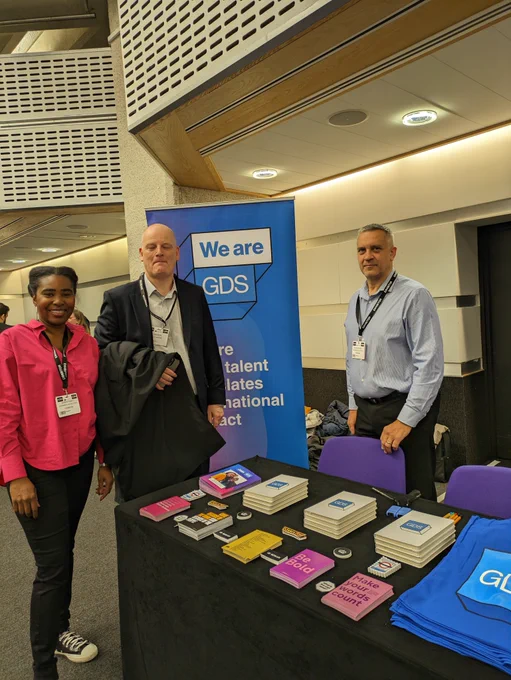 3 Government Digital Service employees at the stand