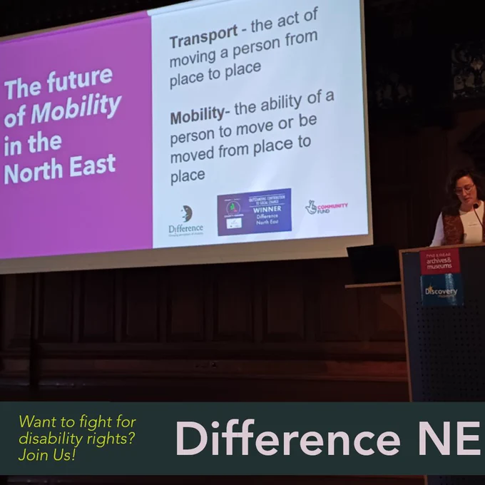 Figure speaking behind a lecturn, slide behind the speaker reads "the future of mobility in the North East. Transport- the act or moving a person from place to place. Mobility - the ability of a person to move or be moved from place to place