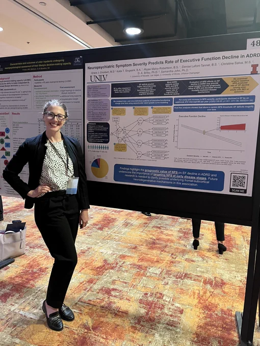 Grace with her poster Neuropsychiatric symptom severity predicts rate of executive function decline in ADRD