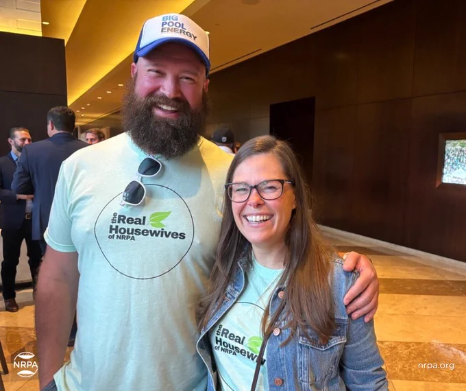 Two park and rec professionals sporting shirts that say "The Real Housewives of NRPA"