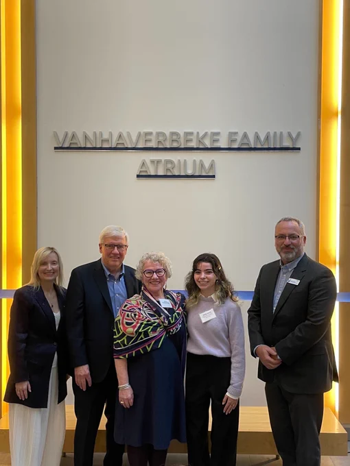 Dr. Carolyn McGregor, Ed and Sylvia, Ontario Tech student and Dr. Steven Murphy in front of the Vanhaverbeke Family Atrium sign.