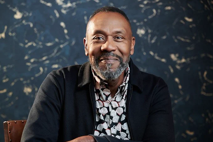 Sir Lenny Henry smiling at the camera
