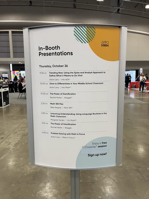 Large standee sign with the HMH Booth Presentation Schedule.