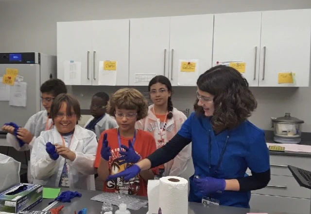 Jensen Young helping with a summer camp at her internship at Renewable Water Resources.