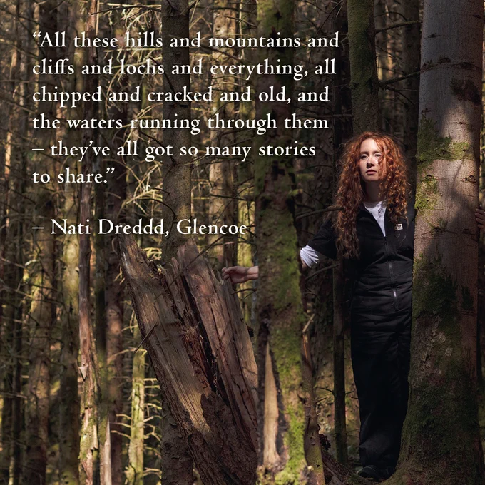 Nati Dreddd next to a tree in a forest