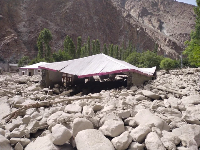 Image (c) Aga Khan Agency, building destruction after debris flow/floods
