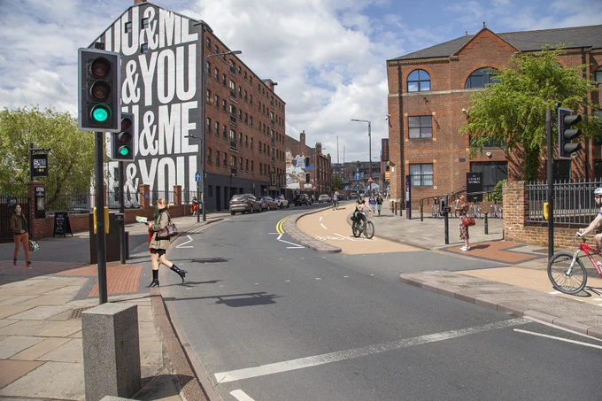Artist's impression of The Calls, featuring two-way protected cycle track and new pedestrian crossings.