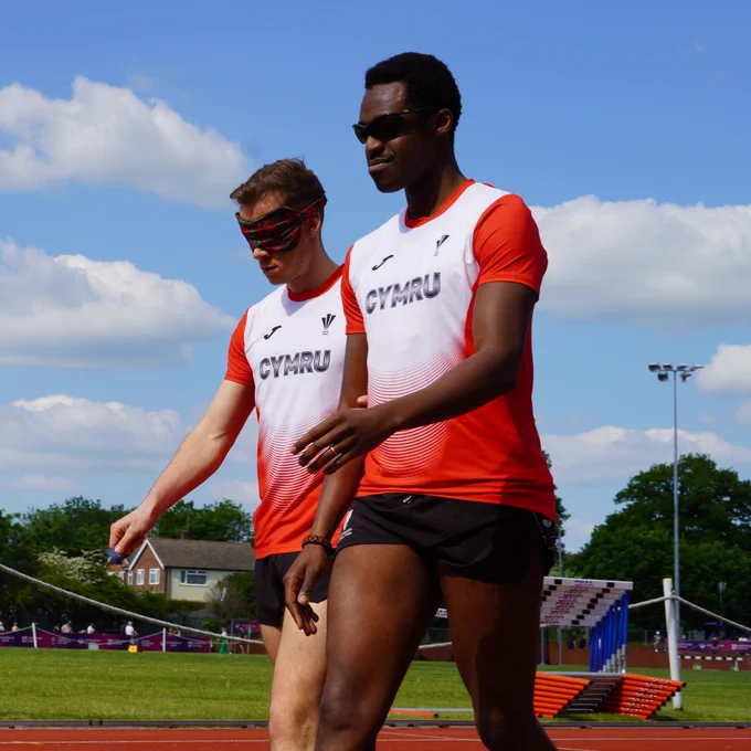 James Ledger (left) pictured with guide runner Makoye	Kampengele (right) at the Loughborough International.
