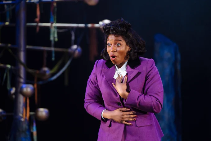 Aminita Francis as Henrietta Lacks in Family Tree, wearing a 1950s purple suit jacket.