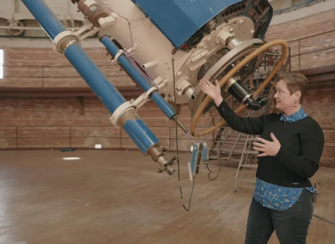 Dr. Bauer with the 41 inch Refractor Telescope