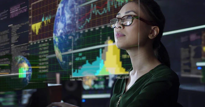 An image of someone looking at charts and graphs.