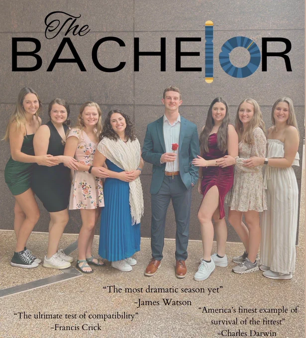 Seven female students surround one male student (the bachelor) who is holding a rose.
