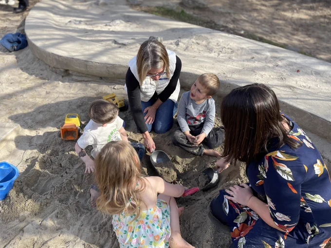 Commissioner Kershaw playing with kids in the sand