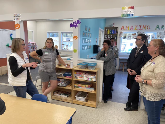 Commissioner Kershaw talking with Children First Executive Director Donna Denette, Senator Jacob Oliveira, Representatives Daniel Carey and Mindy Domb and Kristen Elechko, Governor Healey’s Western Massachusetts Director