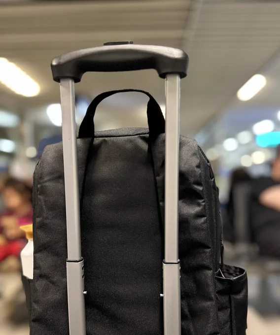 Gift’s backpack and suitcase In foreground