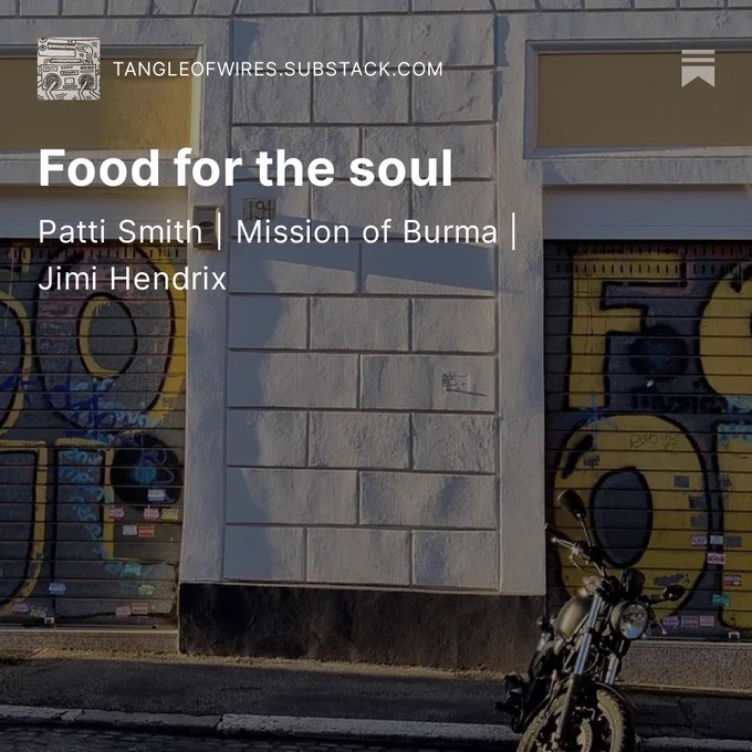 A closed for the day record shop in Rome, its name - Soul Food - spray painted on the shutters