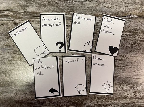 Seven cards, each containing a question or sentence stem ("I notice that..." "What makes you say that," etc.)